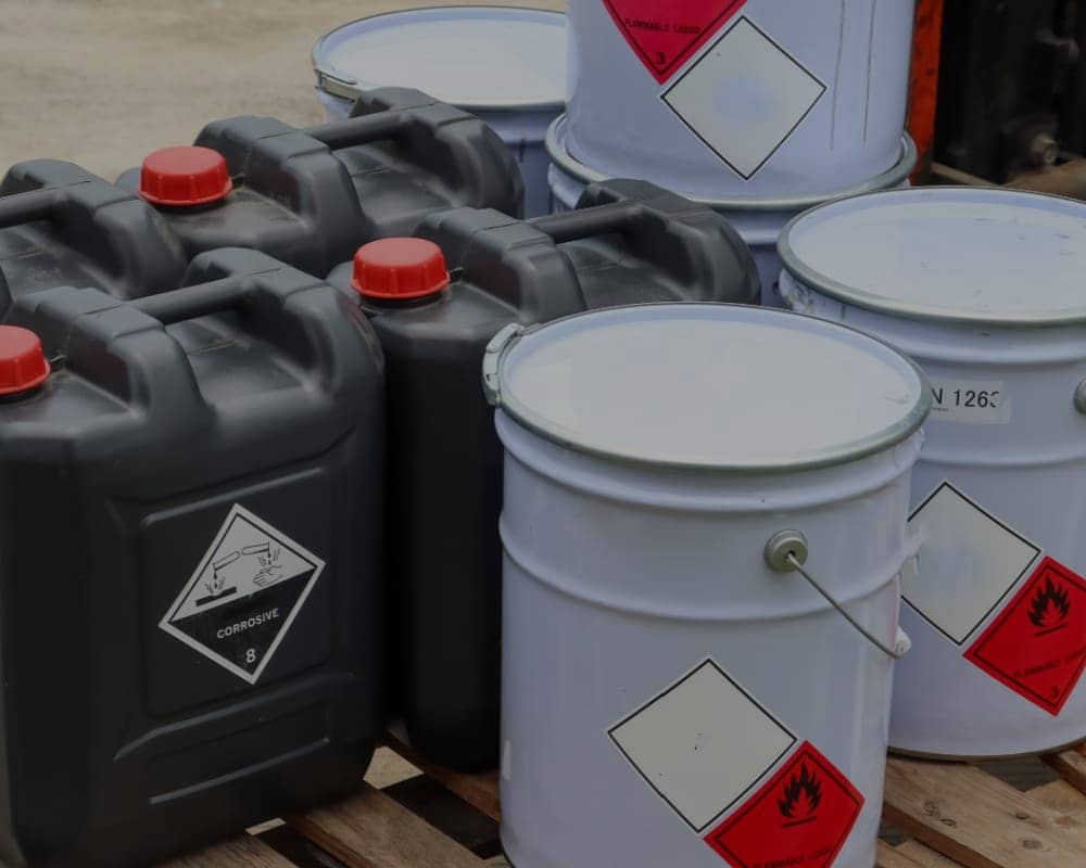 cans of hazardous waste by Phase Associates